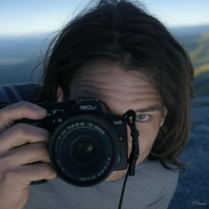 AI-generated photo of Russell taking a mindful photograph in nature
